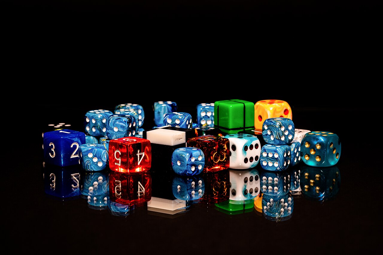 Colorful dice scattered on a surface